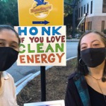 Jessica (left) and one of her interns celebrate National Drive Electric Week