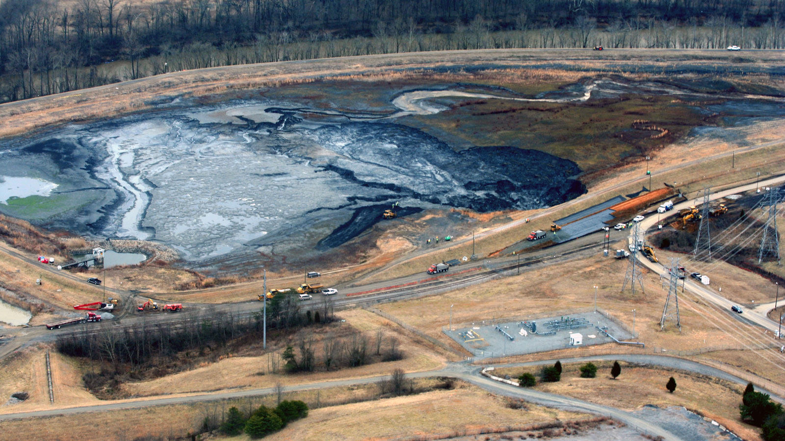 <h4>Coal ash pits</h4> <h5>In 2014, 39,000 tons of toxic coal ash and 27 million gallons of coal ash pit water spilled into the Dan River in North Carolina after a pipe burst at the Dan River Steam Station.</h5><em>Waterkeeper Alliance/Rick Dove on Flickr (CC BY-NC 2.0)</em>